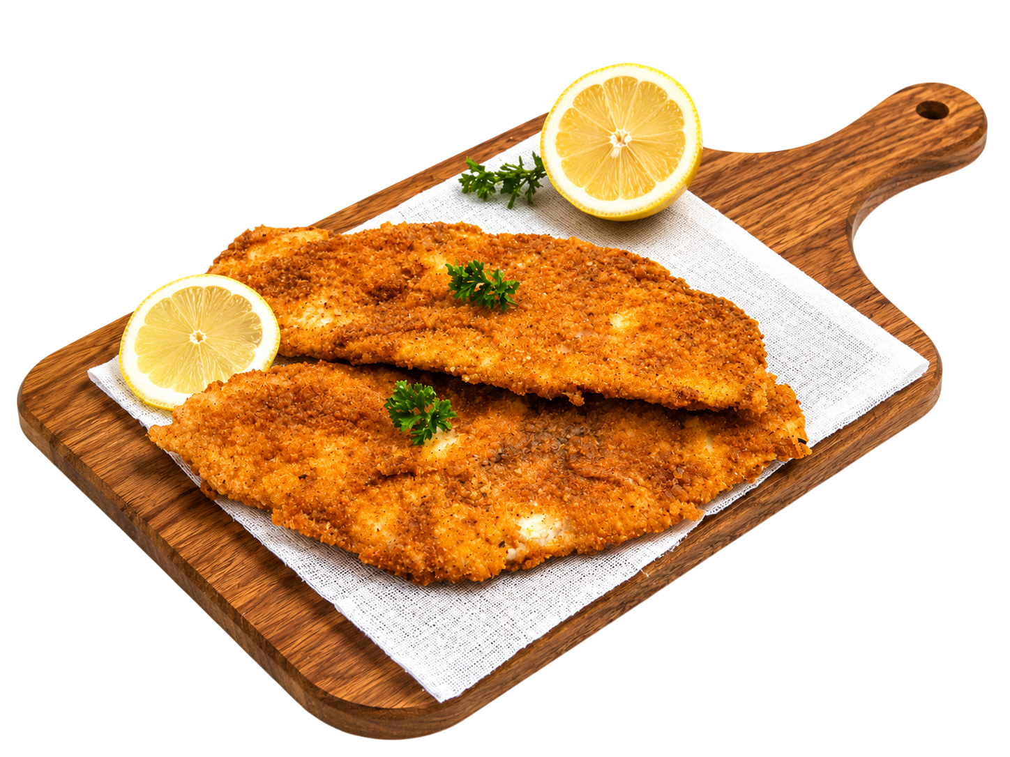 Two breaded fried fish fillets garnished with parsley and lemon halves on a wooden cutting board.